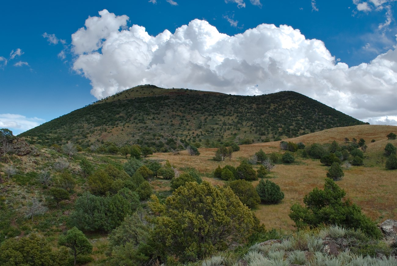 cinder cone and cloudy sky