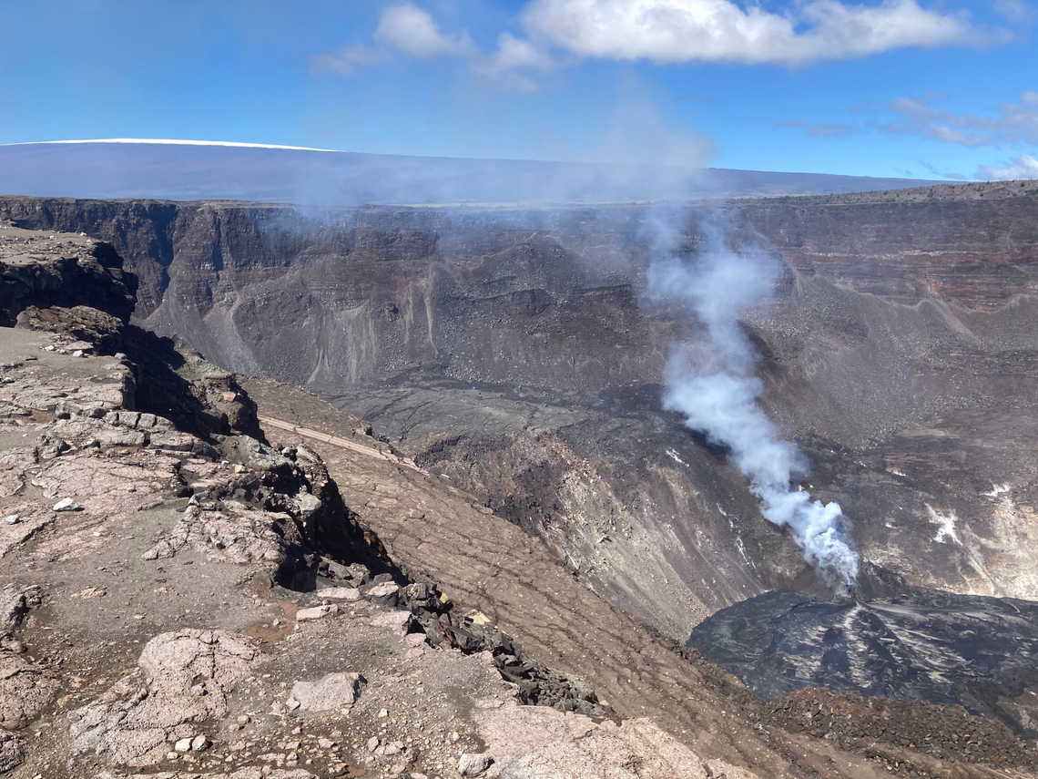 volcanic crater with lava lake in the bottom