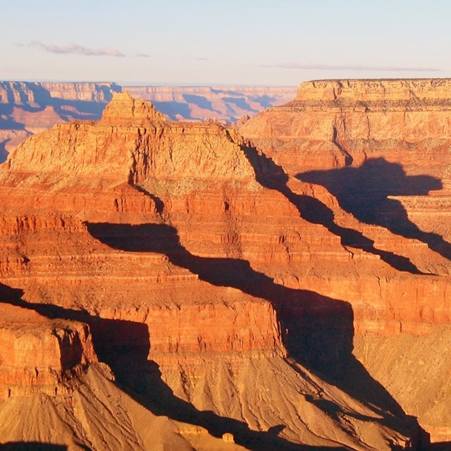 Warm light illuminates the Grand Canyon