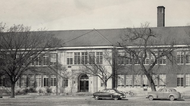 black and white photo of brick monroe elementary building