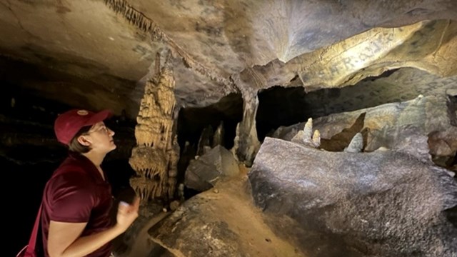 Cave formation with pool of water below