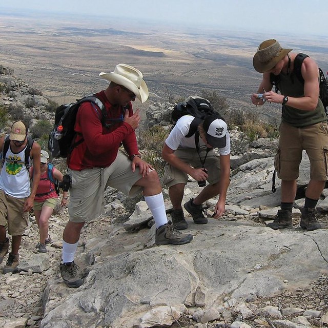 geologist examining a rock out crop