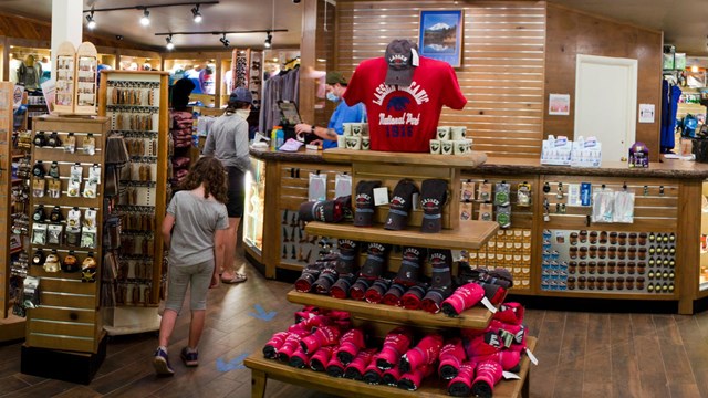 A child and woman inside a gift store.