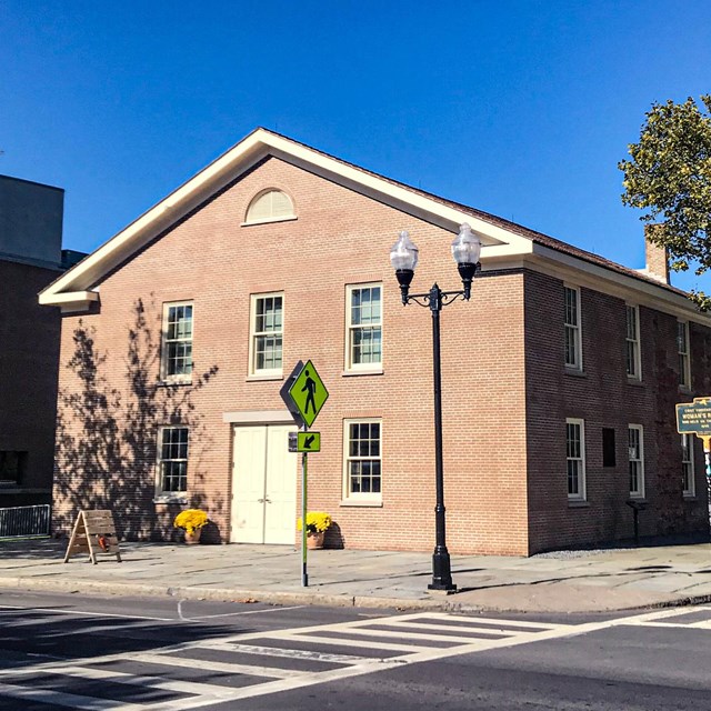 Historic brick church on a street corner 