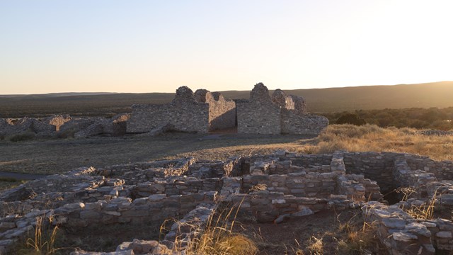 Grey limestone remains of a church and pueblo