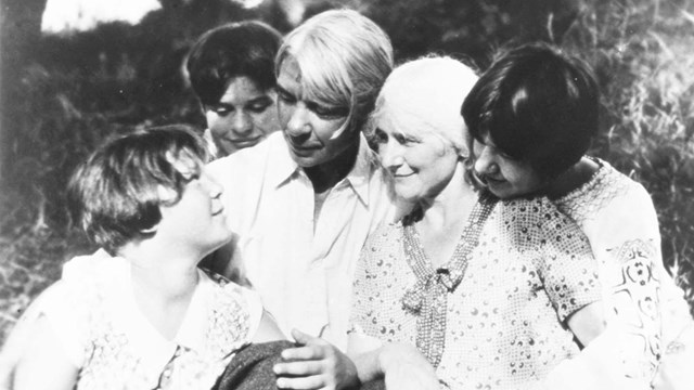 Black and white photo of a man, woman and three young girls