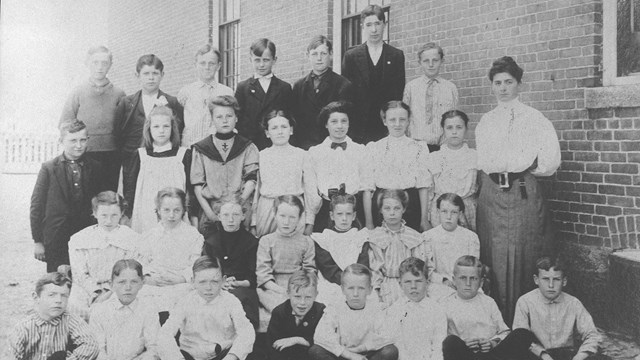 Photo of children outside of the Ashton school house