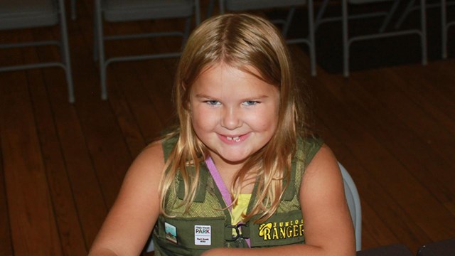 Girl with Junior Ranger Vest