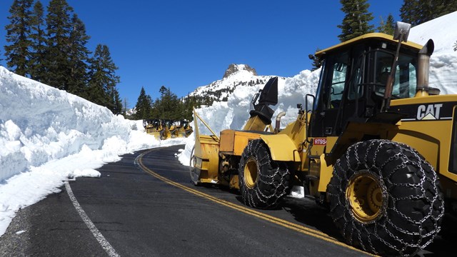 A rotary snow plow clears snow from Lassen National Park Highway