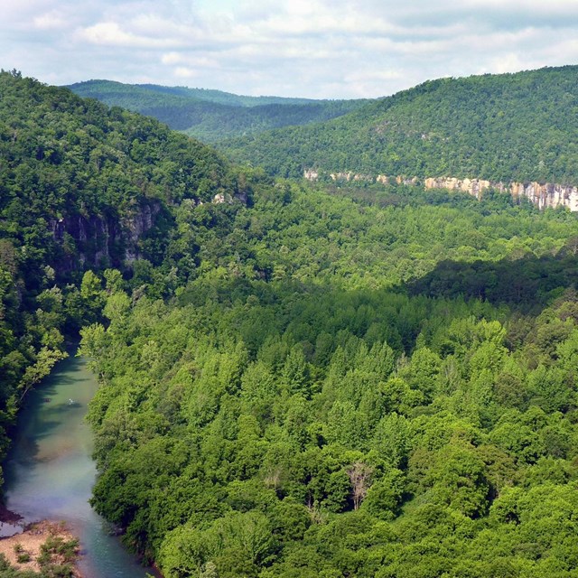 An upper portion of the Buffalo River with Big Bluff in the background.