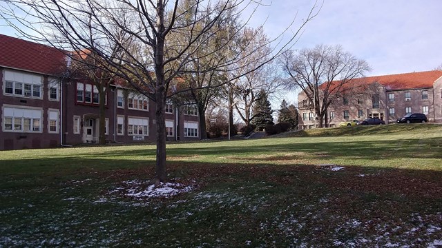 Two large buildings on either side of an open area (quad)