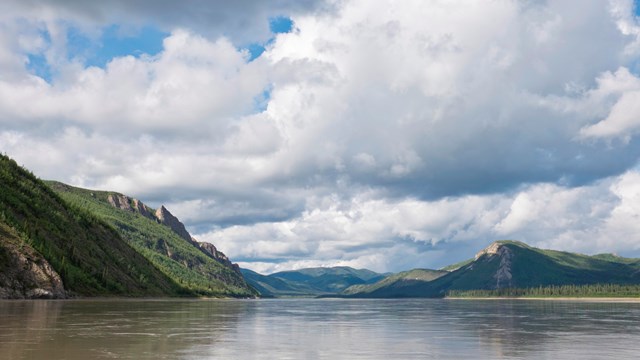 Clouds above the Yukon River and bluffs