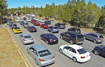 4 long lines of cars waiting to enter the park at the South Entrance Station