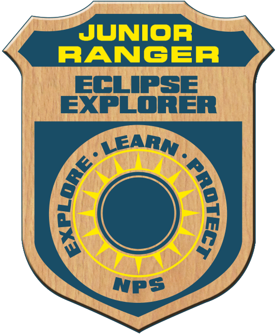A badge with text Junior Ranger Eclipse Explorer