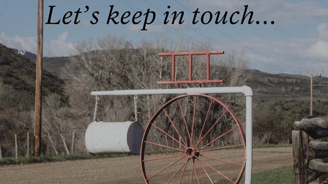 Image of a mailbox with a wagon wheel at the Ladder Livestock Ranch, WY LC-DIG-highsm-38660