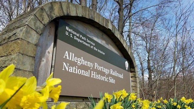 Park entrance sign with flowers