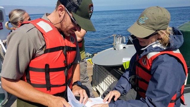 ranger with visitor looking at map