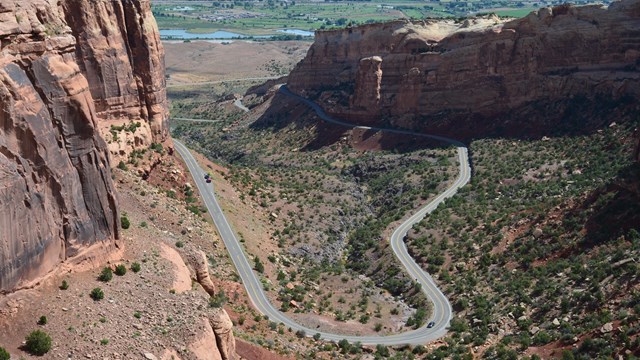 Looking on road winding through floor of a canyon