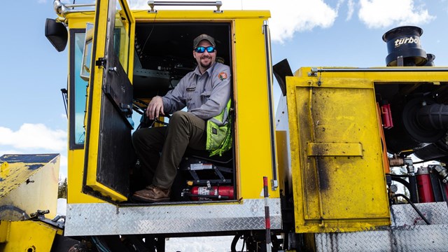 man in big yellow construction machine