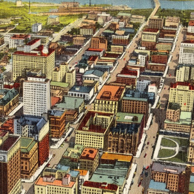 Skyline view of Omaha's business district, postcard dated circa 1930-45. Links to Travel Omaha.