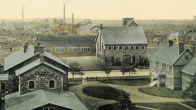 Historic photograph of the Keweenaw History Center and surrounding C&H buildings