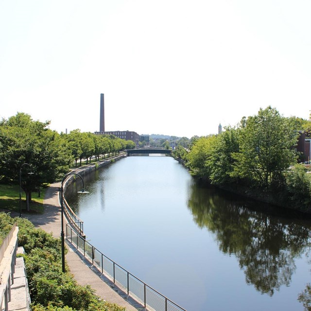 Canal and towpath through a city