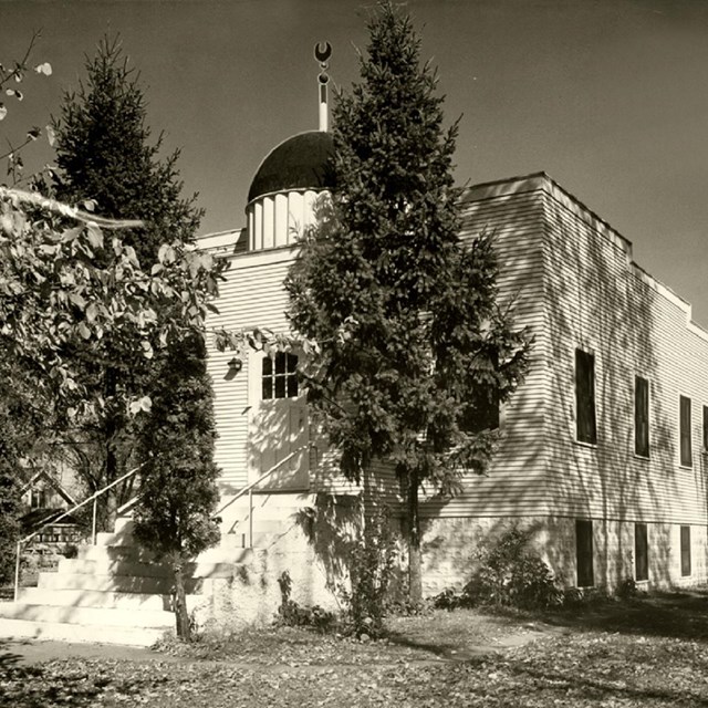 black and white picture of small Mosque with trees