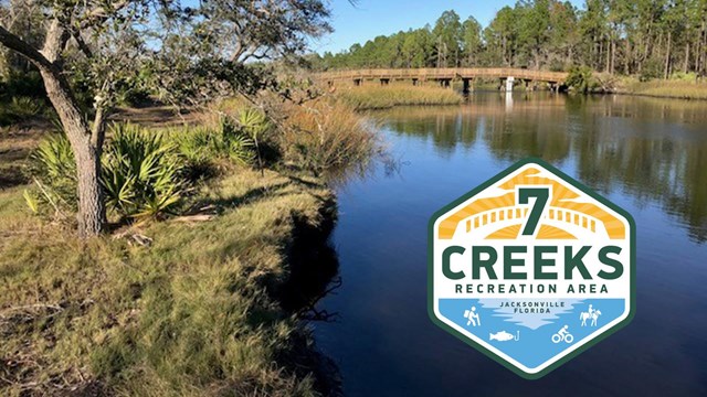 blue rive and a bridge with 7 creeks logo