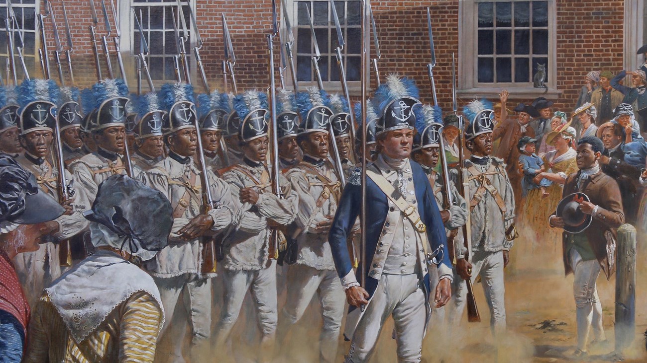 African American soldiers in the Revolutionary War marching down a dusty road with rifles 