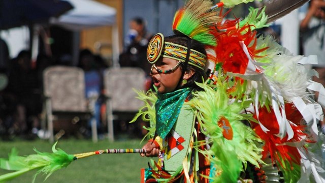 A Ute dancer in traditional clothing