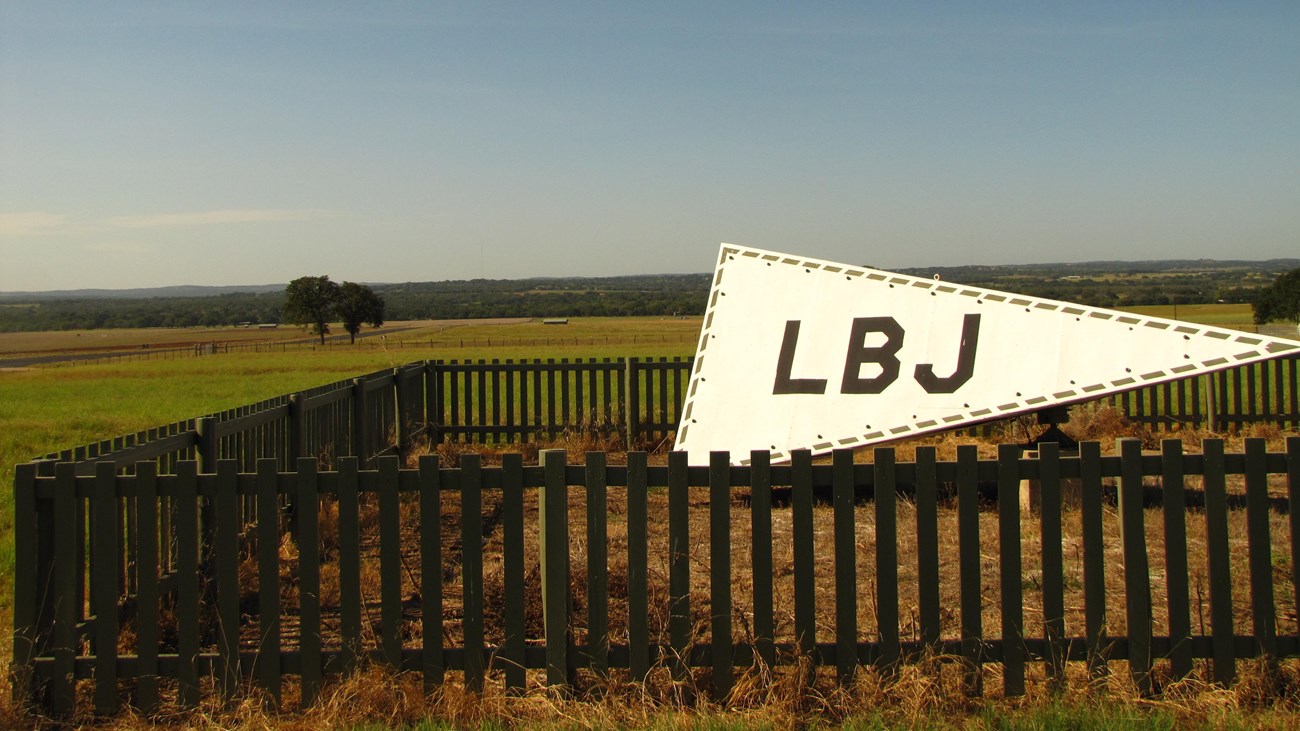 A tetrahedron (air directional marker for the airstrip) sits atop a hill.