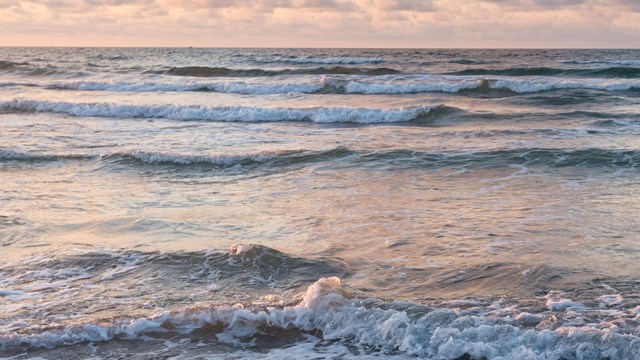 Colorful surf and sky on the beach