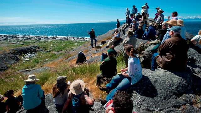 Visitors enjoy sun at the beach.