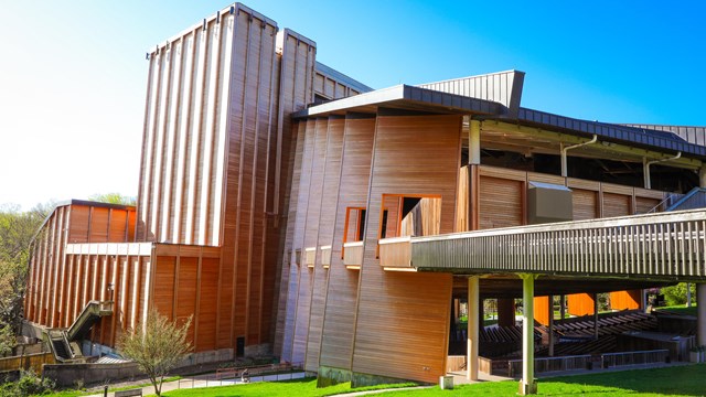 A (left) side view of the outside of the Filene Center