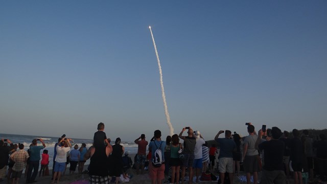 View a rocket launch.