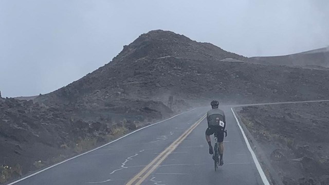 biker in road with misty, foggy conditions