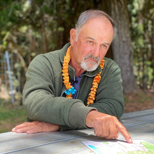 Man pointing to a map. 