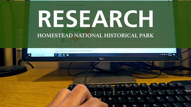 Computer with green banner and white text reading, "Research Homestead NHP"