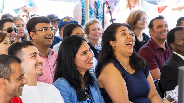 several people sitting and laughing 