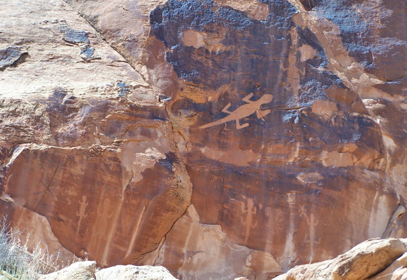 Photo of rock wall with text.