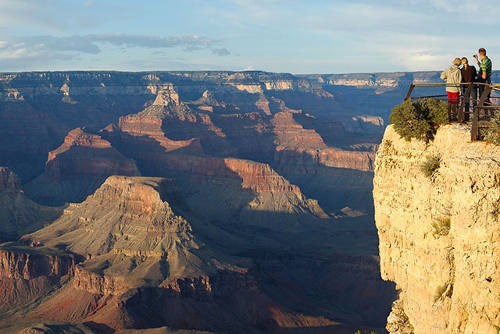 A cliff with an overlook in front of a view of the canyon.