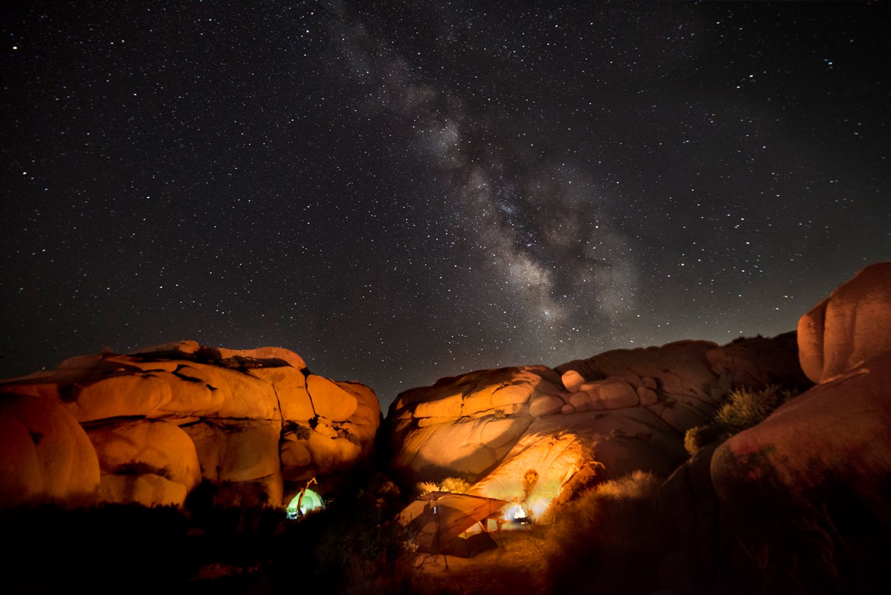 Tent and campsite under the Milky Way