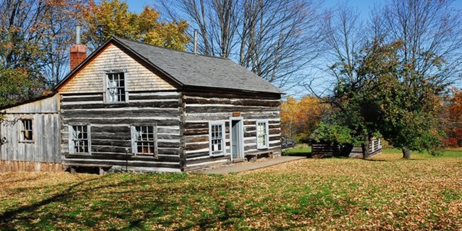 This group of small log houses once provided lodging for miners of the Victoria Mining Company.