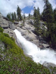 Water cascading down granite cliff face.