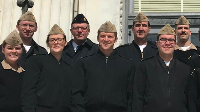 public health team stands in front of the south interior building in Washington, DC