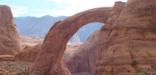 As you approach the viewing area from the docks, Rainbow Bridge peeks out from behind the cliffs.