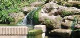 water flowing over rocks into basin