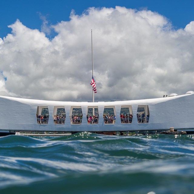 a white long memorial seen from the height of the ocean water