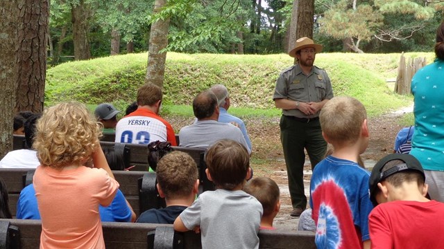 Ranger giving a program to a class at the earthen fort