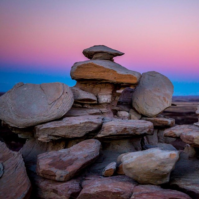 Blue Forest Rock Formations at Dusk